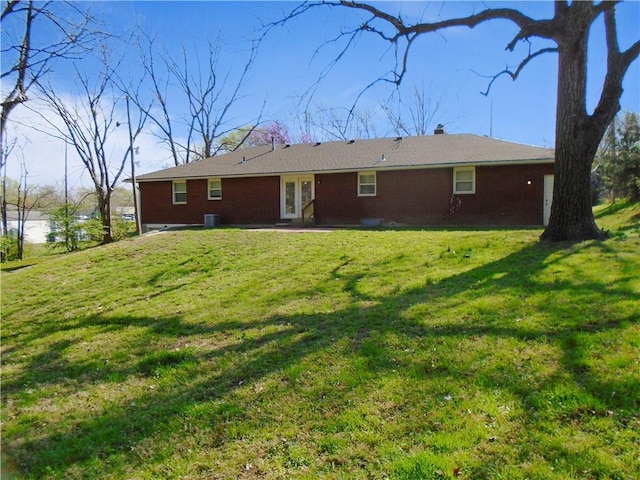 3020 N 81st St, Kansas City, KS 66109 - back of property with brick siding, a yard, cooling unit, and french doors