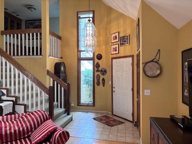 9803 W 121st St, Overland Park, KS 66213 - entryway with stairs, a chandelier, and high vaulted ceiling