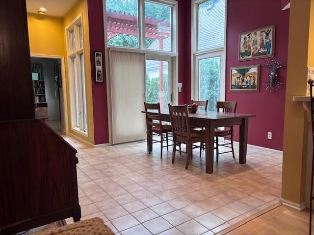 9803 W 121st St, Overland Park, KS 66213 - dining area with a high ceiling and healthy amount of natural light