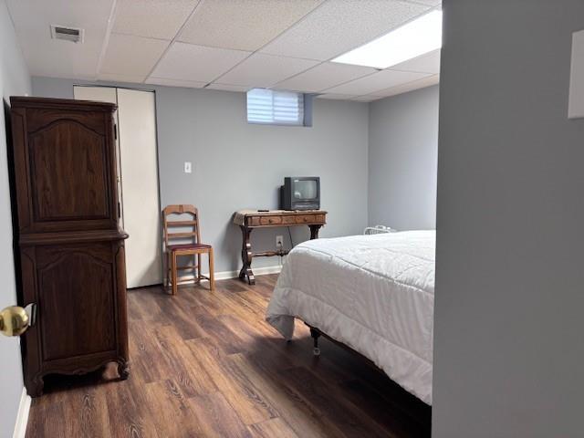 9803 W 121st St, Overland Park, KS 66213 - bedroom featuring dark wood-type flooring and a drop ceiling