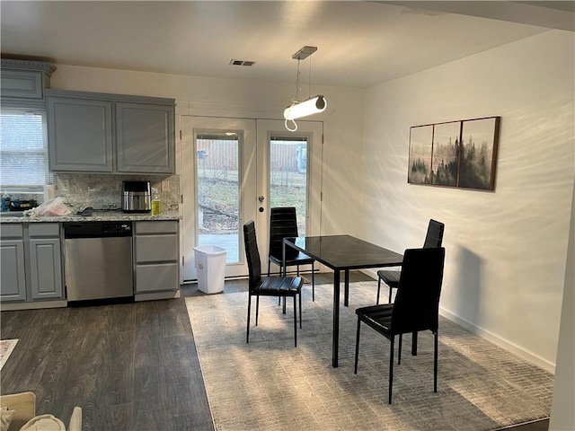 2911 S 26th St, Kansas City, KS 66106 - dining space with dark wood-type flooring and french doors
