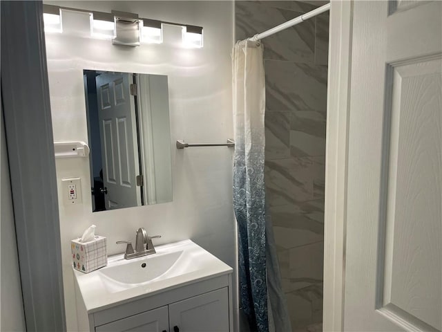 2911 S 26th St, Kansas City, KS 66106 - bathroom featuring vanity and tiled shower