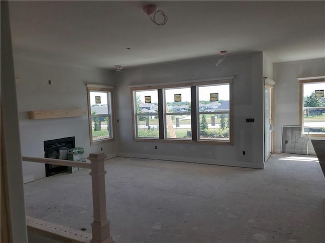 17125 W 168th Pl, Olathe, KS 66062 - unfurnished living room with a fireplace and baseboards