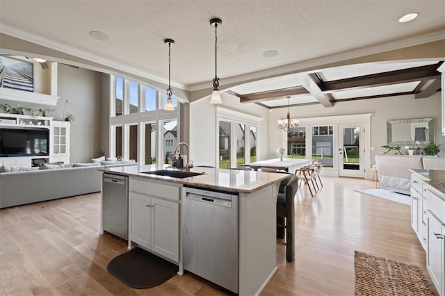 15825 Howe St, Overland Park, KS 66224 - kitchen with open floor plan, dishwasher, a sink, a center island with sink, and light wood-type flooring