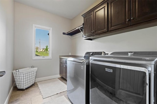 15825 Howe St, Overland Park, KS 66224 - laundry area with cabinet space, washer and clothes dryer, and baseboards