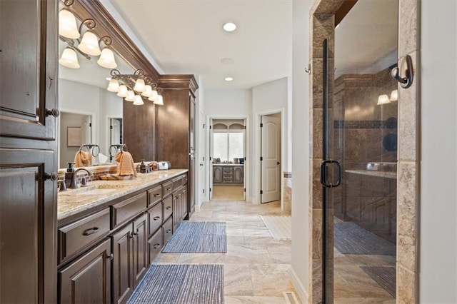 15825 Howe St, Overland Park, KS 66224 - bathroom featuring double vanity, a shower stall, and recessed lighting
