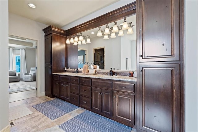 15825 Howe St, Overland Park, KS 66224 - full bath with double vanity, recessed lighting, and baseboards