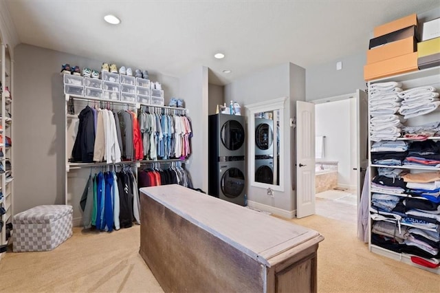 15825 Howe St, Overland Park, KS 66224 - walk in closet featuring stacked washing machine and dryer and light carpet