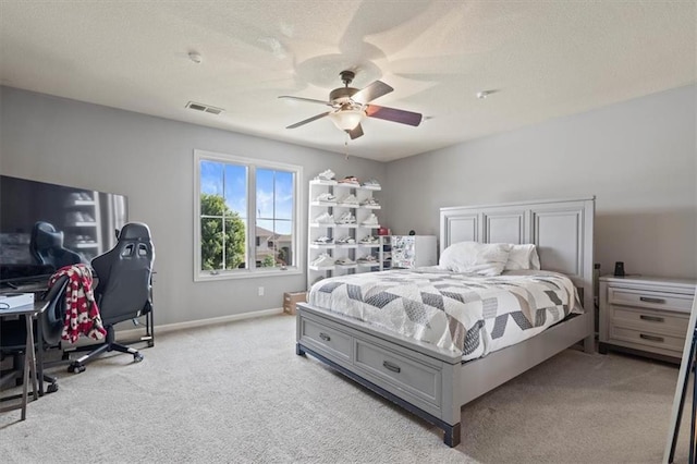 15825 Howe St, Overland Park, KS 66224 - bedroom with light carpet, baseboards, ceiling fan, a desk, and a textured ceiling