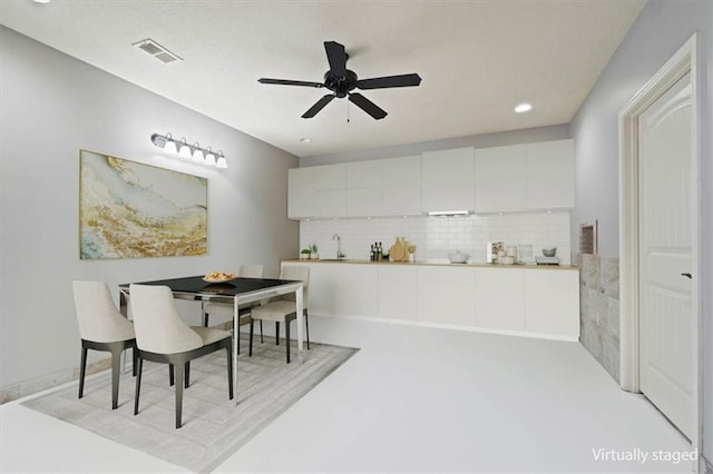 15825 Howe St, Overland Park, KS 66224 - dining room featuring a ceiling fan and recessed lighting