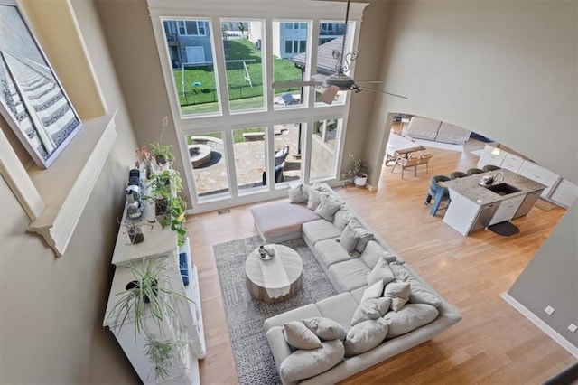 15825 Howe St, Overland Park, KS 66224 - living area featuring a towering ceiling and wood finished floors