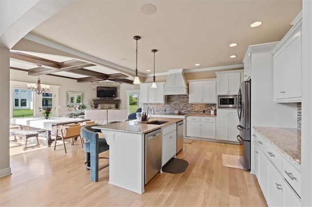 15825 Howe St, Overland Park, KS 66224 - kitchen with stainless steel appliances, a sink, custom exhaust hood, tasteful backsplash, and white cabinets