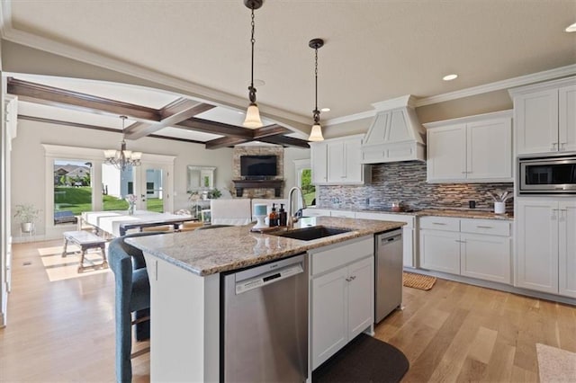 15825 Howe St, Overland Park, KS 66224 - kitchen with stainless steel appliances, a sink, custom range hood, recessed lighting, and tasteful backsplash