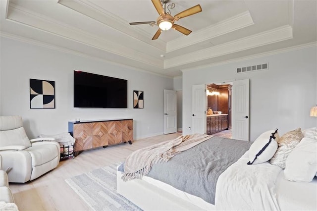 15825 Howe St, Overland Park, KS 66224 - bedroom with a tray ceiling, light wood-type flooring, ornamental molding, ensuite bathroom, and a ceiling fan