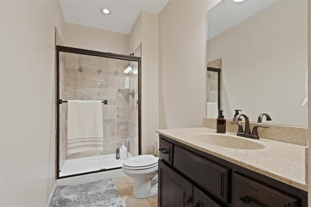 15825 Howe St, Overland Park, KS 66224 - bathroom featuring toilet, vanity, and a stall shower