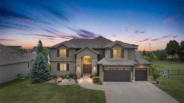 15825 Howe St, Overland Park, KS 66224 - traditional-style house with cooling unit, concrete driveway, stucco siding, a garage, and stone siding