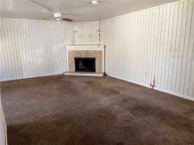 2905 S 50th St, Kansas City, KS 66106 - unfurnished living room featuring carpet floors, ceiling fan, and a fireplace with raised hearth