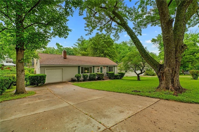 5347 Buena Vista St, Roeland Park, KS 66205 - view of front facade with a garage, a front lawn, a chimney, and driveway