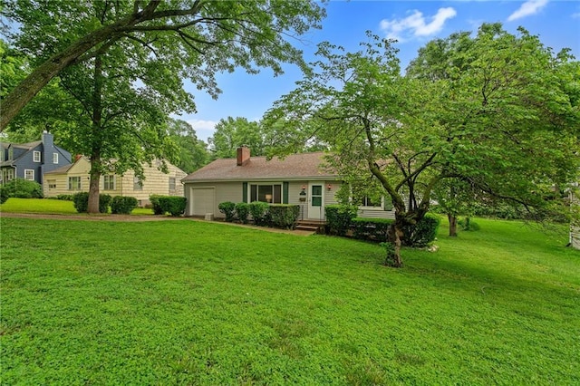 5347 Buena Vista St, Roeland Park, KS 66205 - view of front of home featuring an attached garage, a front yard, and a chimney