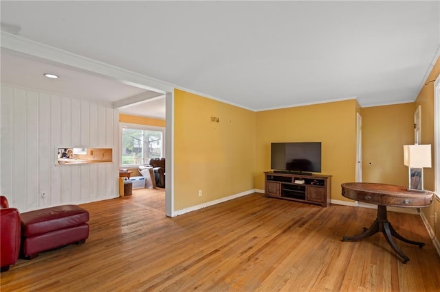 5347 Buena Vista St, Roeland Park, KS 66205 - living area with light wood-style flooring, baseboards, and ornamental molding