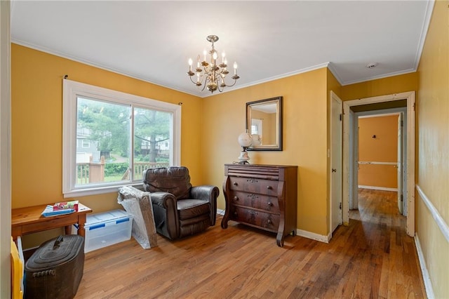 5347 Buena Vista St, Roeland Park, KS 66205 - living area with a chandelier, wood finished floors, ornamental molding, and baseboards