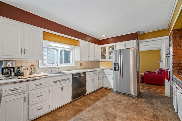 5347 Buena Vista St, Roeland Park, KS 66205 - kitchen with appliances with stainless steel finishes, a sink, light countertops, white cabinets, and ornamental molding