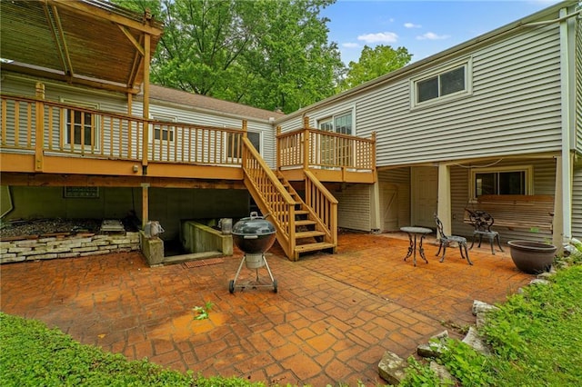 5347 Buena Vista St, Roeland Park, KS 66205 - rear view of house featuring a deck, a patio, and stairway