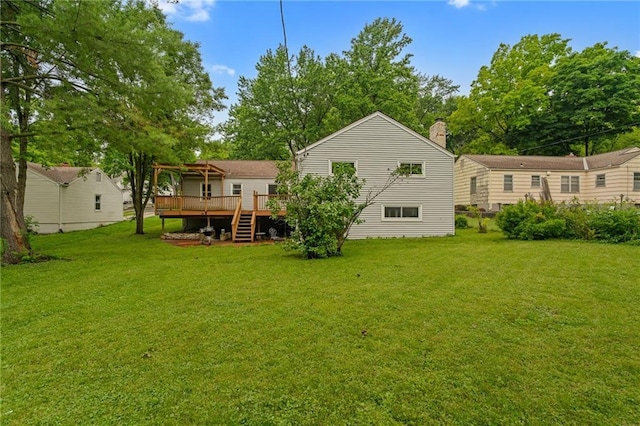 5347 Buena Vista St, Roeland Park, KS 66205 - back of property with a wooden deck, a lawn, stairway, and a pergola