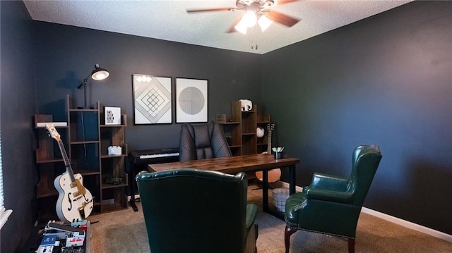 office space featuring ceiling fan, carpet flooring, and baseboards