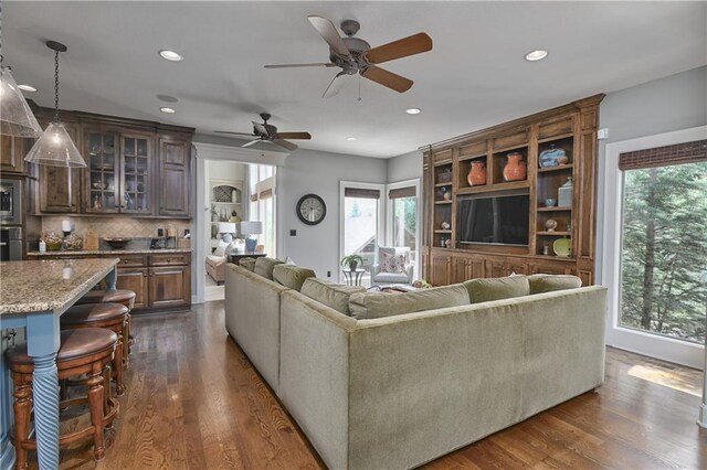 4502 Verona Ct, Riverside, MO 64150 - living room with plenty of natural light, dark wood-style floors, a ceiling fan, and recessed lighting