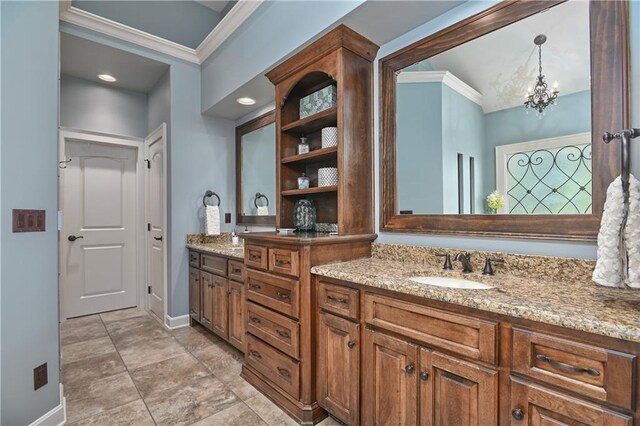 4502 Verona Ct, Riverside, MO 64150 - bathroom with ornamental molding, baseboards, double vanity, and a chandelier