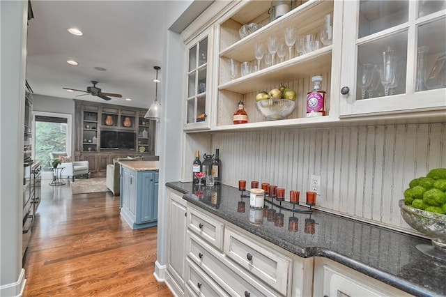 4502 Verona Ct, Riverside, MO 64150 - indoor dry bar with a ceiling fan, wood finished floors, recessed lighting, and hanging light fixtures