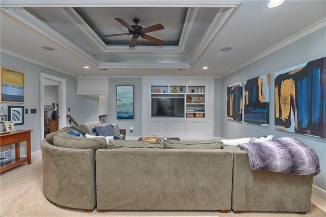 4502 Verona Ct, Riverside, MO 64150 - carpeted living room with crown molding, recessed lighting, ceiling fan, a tray ceiling, and baseboards