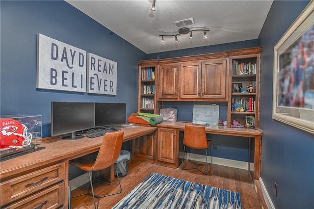 4502 Verona Ct, Riverside, MO 64150 - home office with built in study area and wood finished floors
