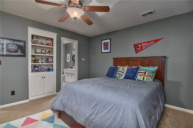 4502 Verona Ct, Riverside, MO 64150 - carpeted bedroom with ensuite bath, baseboards, and a ceiling fan