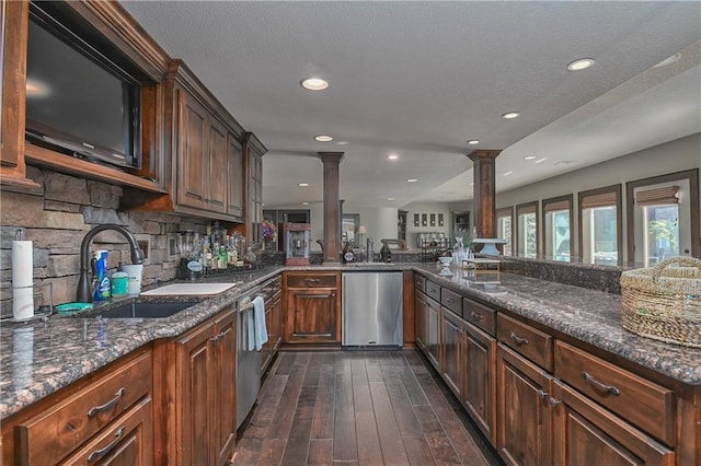 4502 Verona Ct, Riverside, MO 64150 - kitchen with dishwasher, decorative columns, dark wood-style flooring, a sink, and recessed lighting
