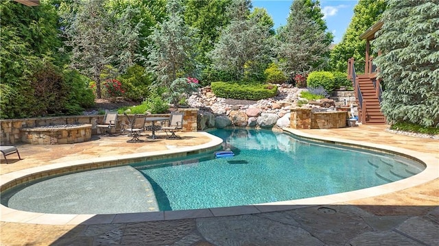 4502 Verona Ct, Riverside, MO 64150 - swimming pool with stairs and a patio area