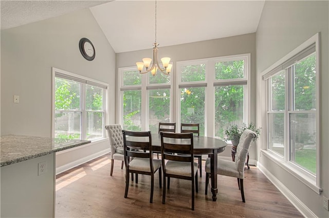 dining space with a chandelier, vaulted ceiling, baseboards, and dark wood-style flooring