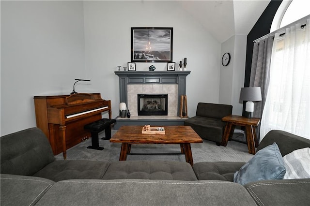 15363 S Darnell St, Olathe, KS 66062 - carpeted living area featuring vaulted ceiling and a tile fireplace