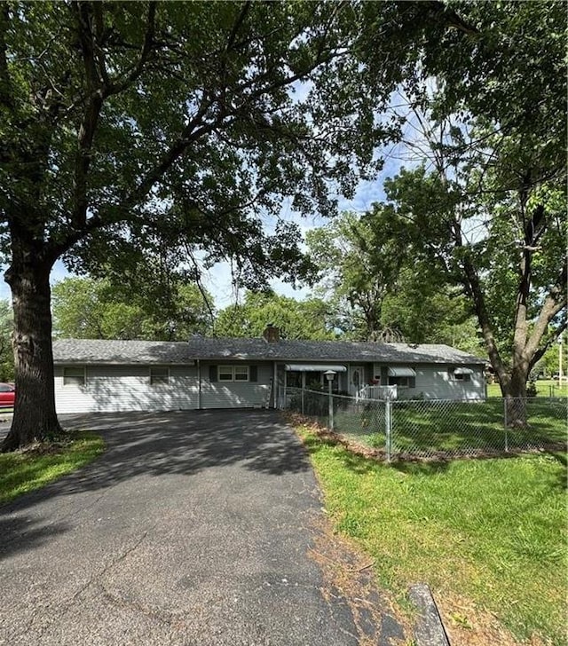 209 S 4th St, Arma, KS 66712 - ranch-style home featuring asphalt driveway and a chimney