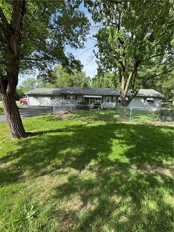 209 S 4th St, Arma, KS 66712 - view of yard featuring asphalt driveway
