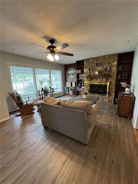 209 S 4th St, Arma, KS 66712 - living room with a textured ceiling, wood finished floors, ceiling fan, and built in features