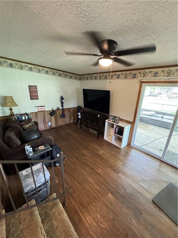 209 S 4th St, Arma, KS 66712 - living room featuring wood finished floors and ceiling fan