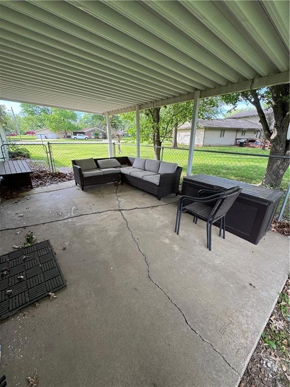 209 S 4th St, Arma, KS 66712 - view of patio / terrace featuring an outdoor hangout area