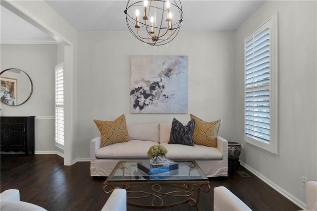 5318 W 159th Ter, Overland Park, KS 66085 - living area featuring a chandelier, wood finished floors, and baseboards