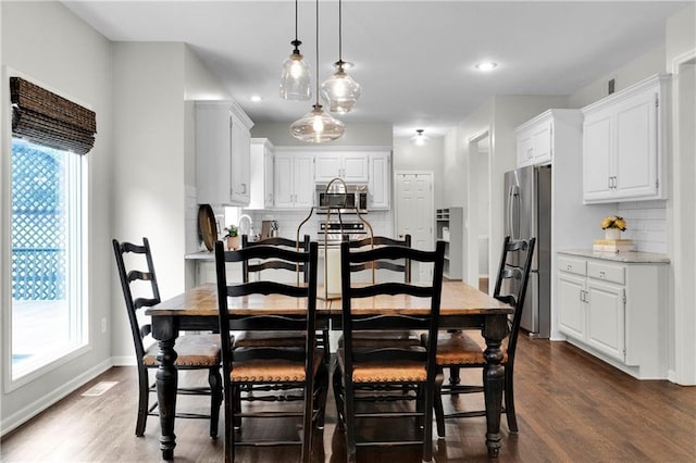 5318 W 159th Ter, Overland Park, KS 66085 - dining area with dark wood finished floors, recessed lighting, and baseboards