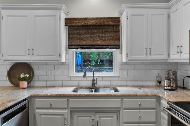 5318 W 159th Ter, Overland Park, KS 66085 - kitchen featuring stainless steel dishwasher, a sink, white cabinetry, and tasteful backsplash