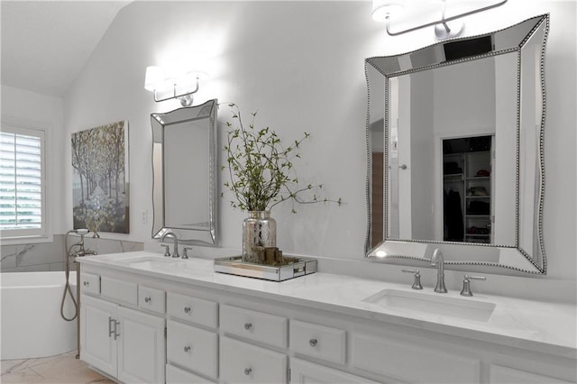 5318 W 159th Ter, Overland Park, KS 66085 - bathroom featuring vaulted ceiling, double vanity, a tub to relax in, and a walk in closet