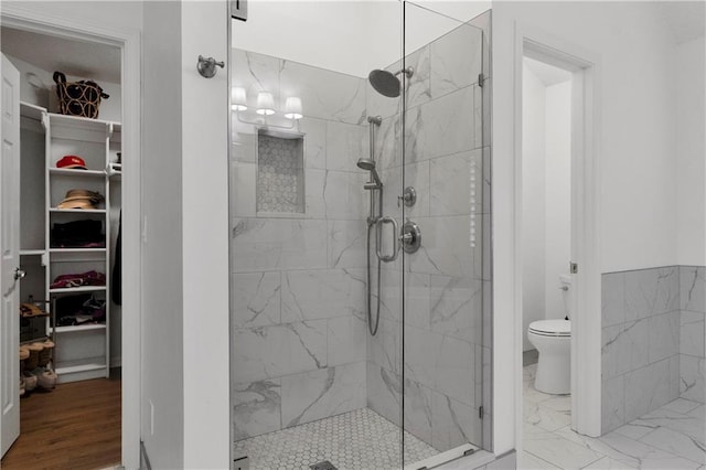 5318 W 159th Ter, Overland Park, KS 66085 - full bath with a shower stall, toilet, a spacious closet, and marble look tiles