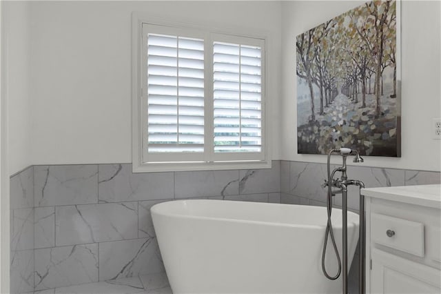 5318 W 159th Ter, Overland Park, KS 66085 - full bath featuring a soaking tub, tile walls, vanity, and a wainscoted wall